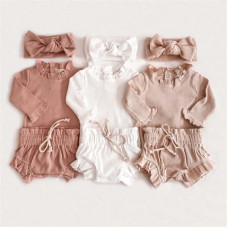 A set of long sleeve bodysuits and shorts