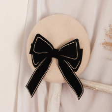 Beret with a bow
