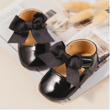 Patent booties with a bow