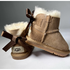 UGG boots on sheepskin UGG with a bow